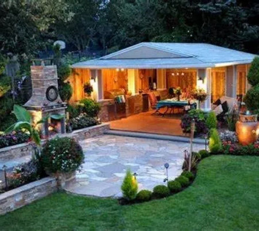 Luxurious backyard with covered patio, fireplace, and landscaped outdoor living space by Red Cloak Wood Designs.