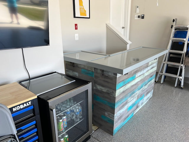 Custom coastal L shaped bar with gray and aqua wood tones, built for indoor or outdoor spaces by Red Cloak Wood Designs.