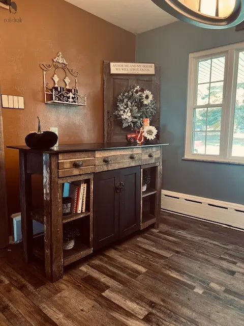 Handmade wood kitchen island with antique black cabinet and barnwood top, placed near large window. Made by Red Cloak Wood Designs