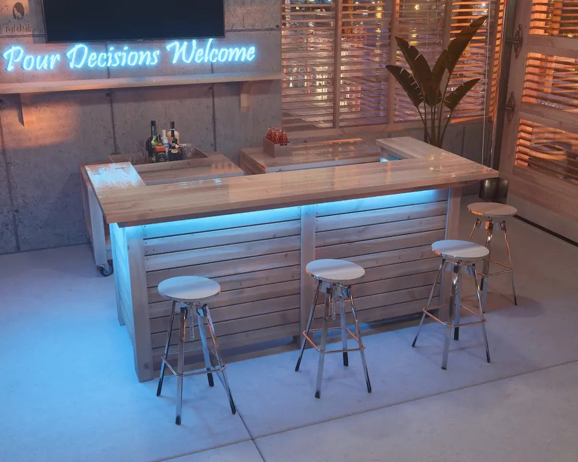Indoor wood bar with back bar storage and LED lighting, handcrafted by Red Cloak for entertaining at home