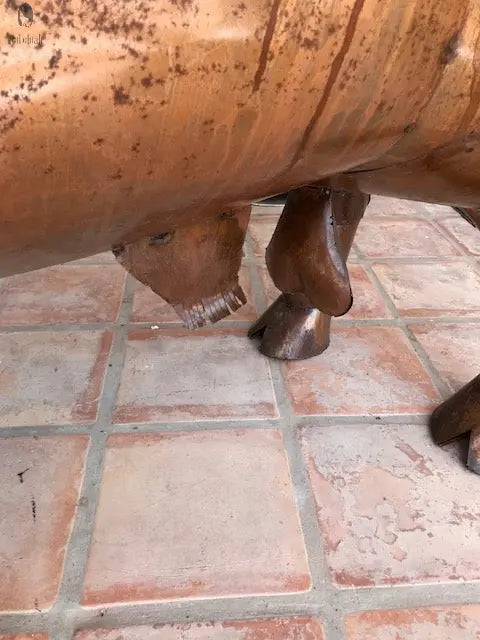 hand-welded hoof of copper longhorn steer BBQ grill on patio tiles, artisan grill construction. Handmade by Red Cloak Wood Designs