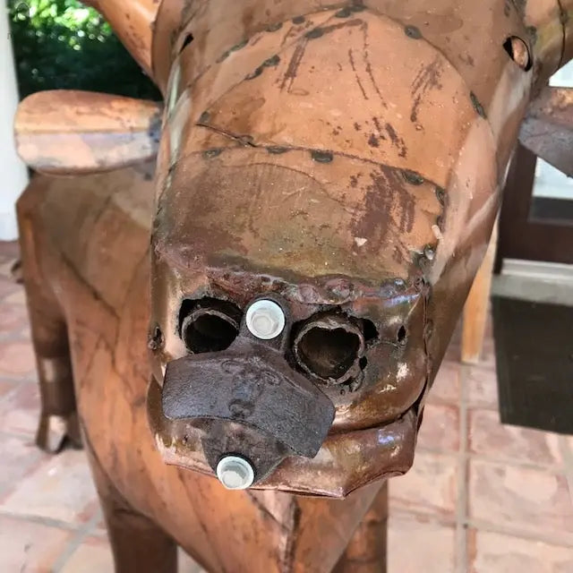 close-up of detailed longhorn grill nose with welded nostrils and patina finish, artistic functional grill. Handmade by Red Cloak Wood Designs