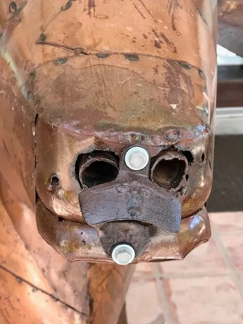 detailed shot of bolt-fixed nostrils and patina detail on longhorn BBQ grill head, Red Cloak Wood Designs handmade