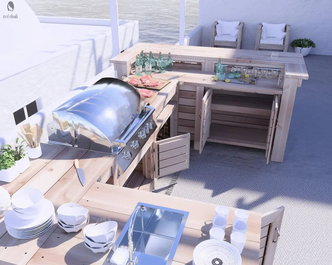 Outdoor kitchen island with open cabinet doors showing interior storage, handcrafted by Red Cloak Wood Designs