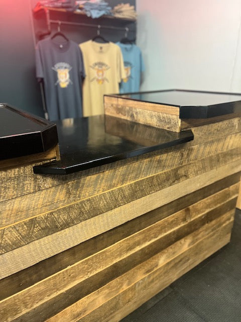 Front close-up of the reclaimed wood cash wrap counter highlighting wood texture and build
