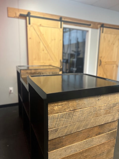 Side profile showing deep shelving and reclaimed wood paneling on a cash wrap counter