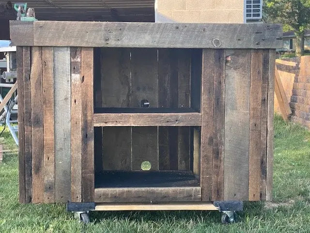 Reclaimed barnwood sofa table by Red Cloak, featuring rough-hewn texture and rustic finish, photographed outdoors in natural light.