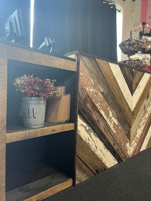 Retail cash wrap station with floral decor and reclaimed wood chevron finish – Red Cloak Wood Designs