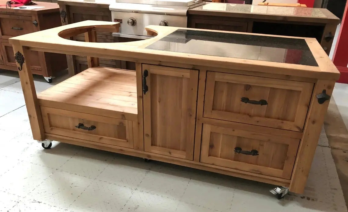 Natural cedar smoker cart with granite top and black drawer pulls, designed to fit Kamado-style grills outdoors.