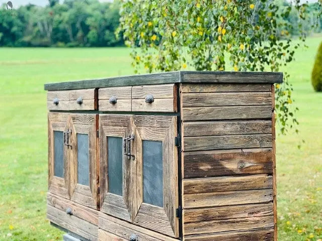 Side detail of reclaimed wood kitchen island cabinet showing aged barnwood texture and joinery – Red Cloak Wood Designs
