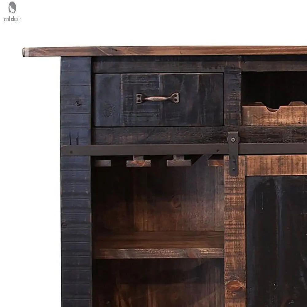 Close-up of rustic wood kitchen island showing wine glass rack and interior shelf cabinet built from reclaimed barnwood
