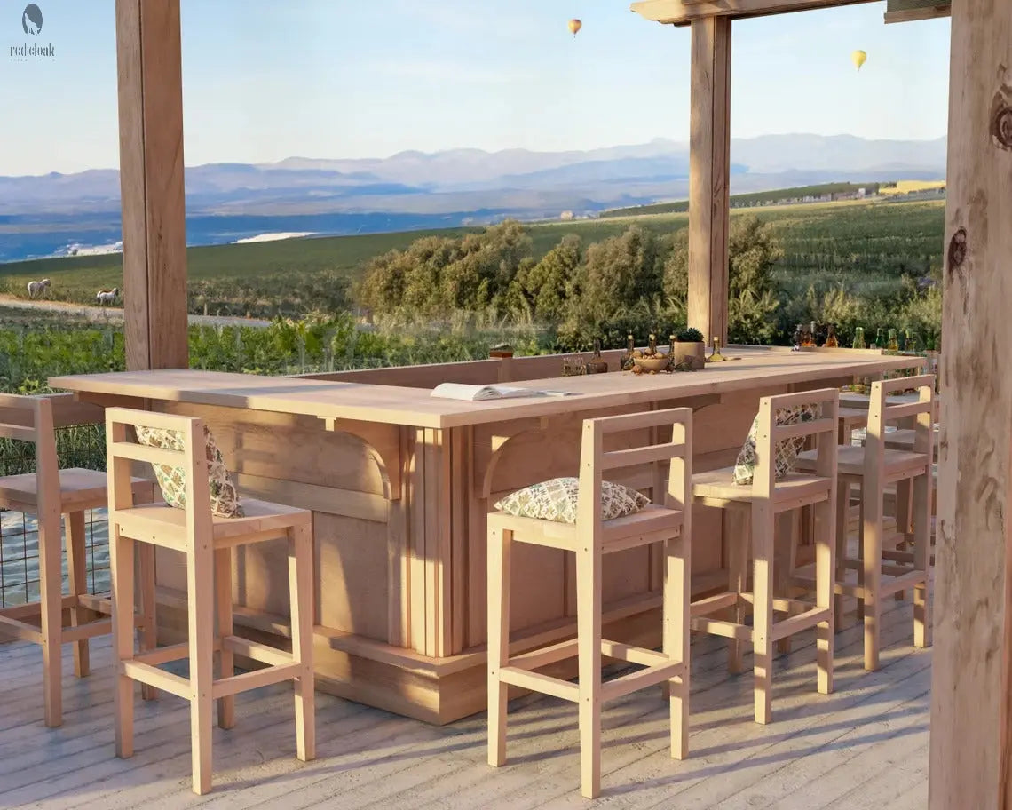 Detail view of Red Cloak U shaped outdoor bar top with open book and bottles overlooking a vineyard
