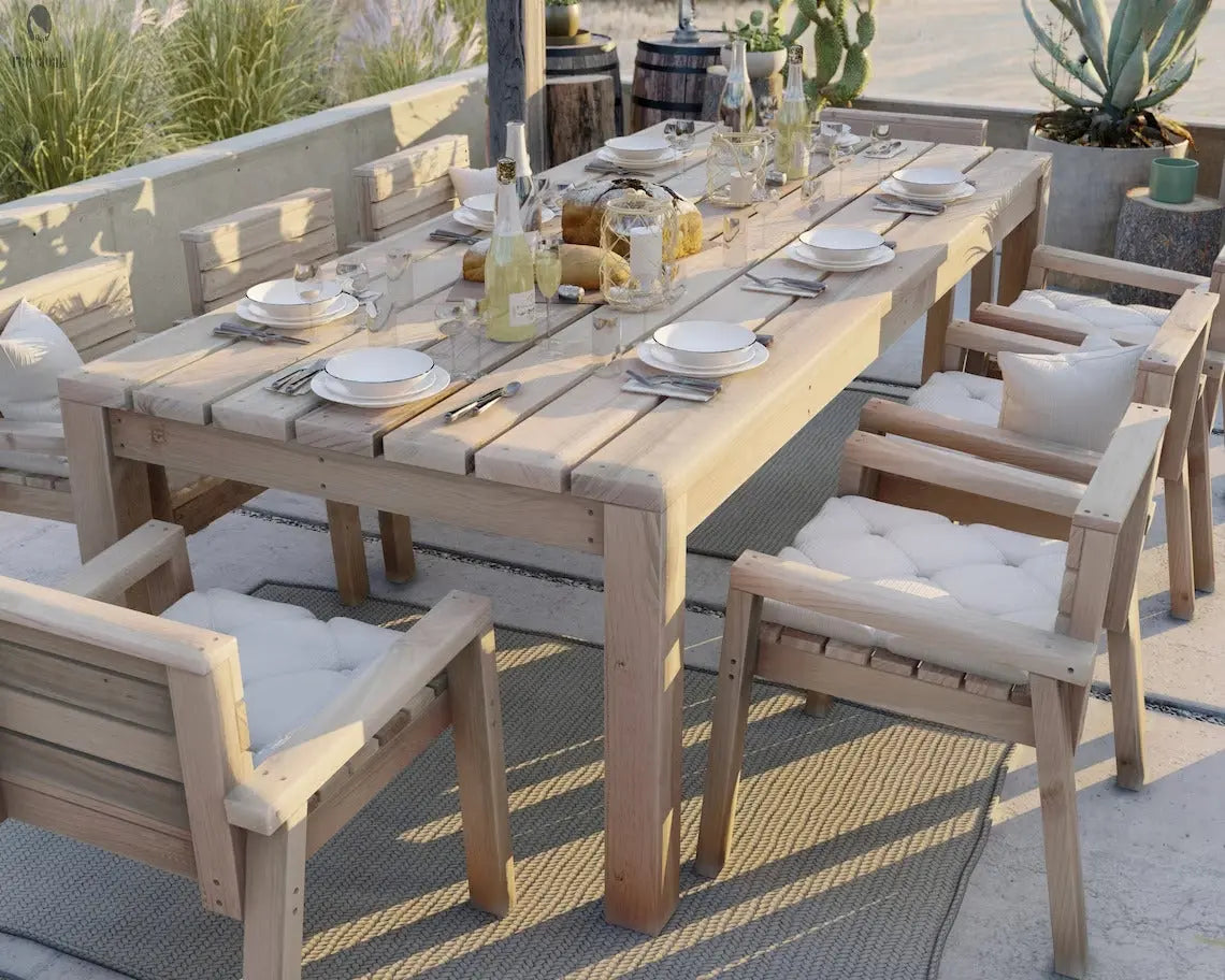 Handmade reclaimed wood dining set glowing in the evening sun, placed on a serene patio with views of surrounding nature