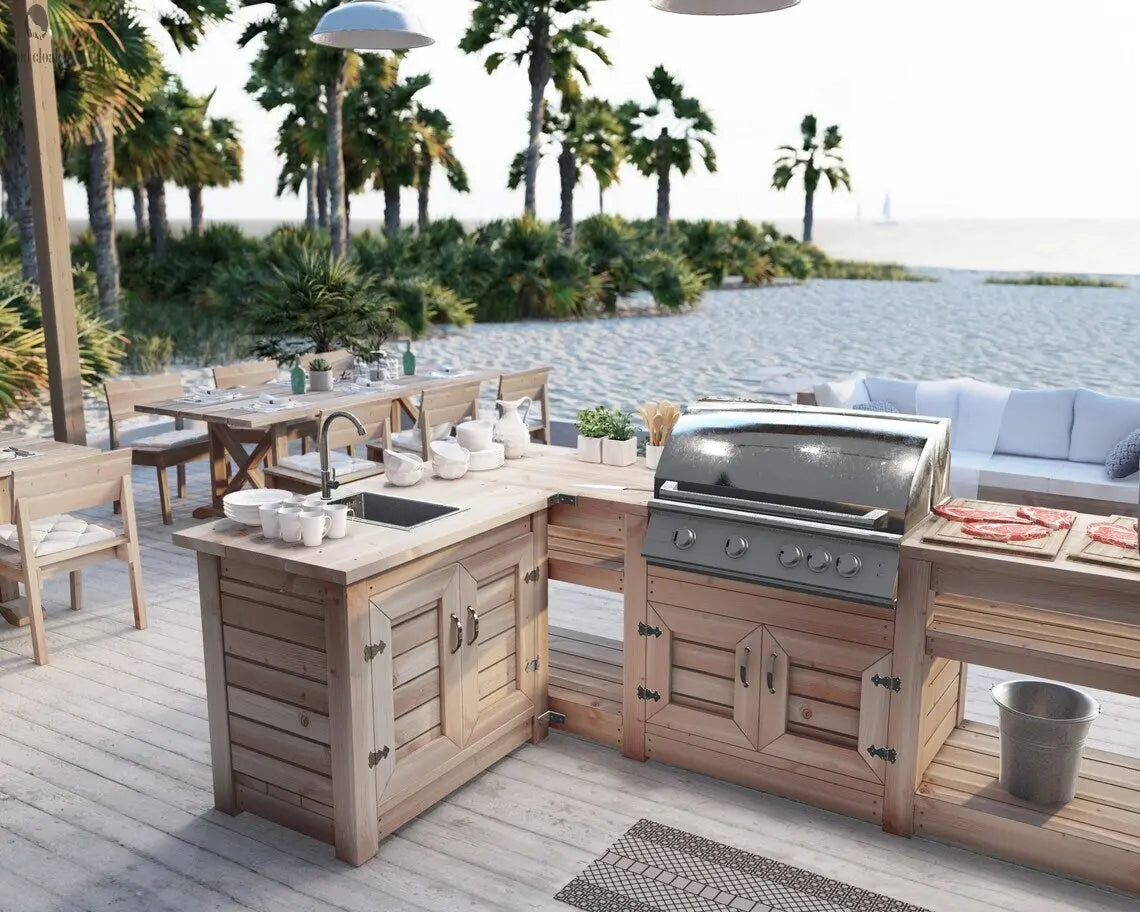 U-shaped custom outdoor kitchen with sink, wood base, and built-in grill, set on a boardwalk-style patio under palm trees