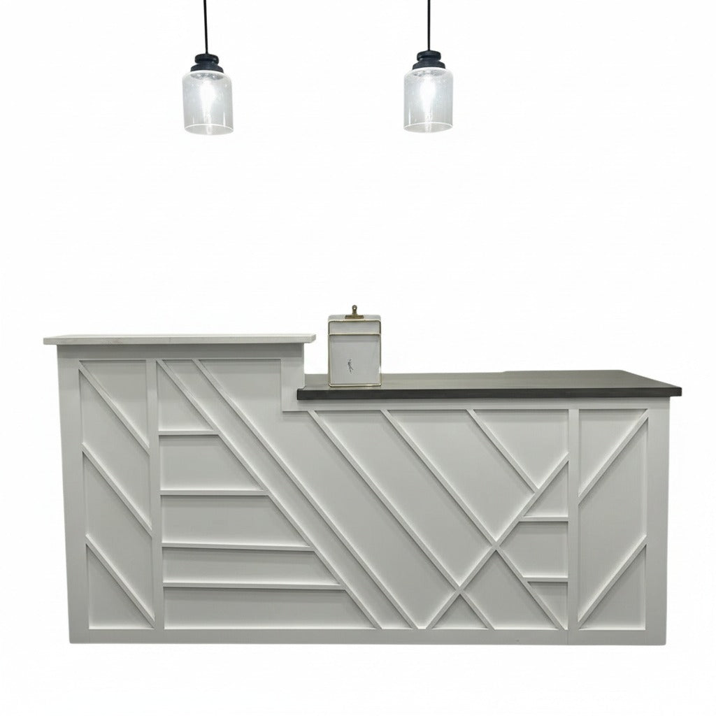 Long white reception counter with geometric detailing, dark wood top, and lower side work surface. Handmade by Red Cloak Home