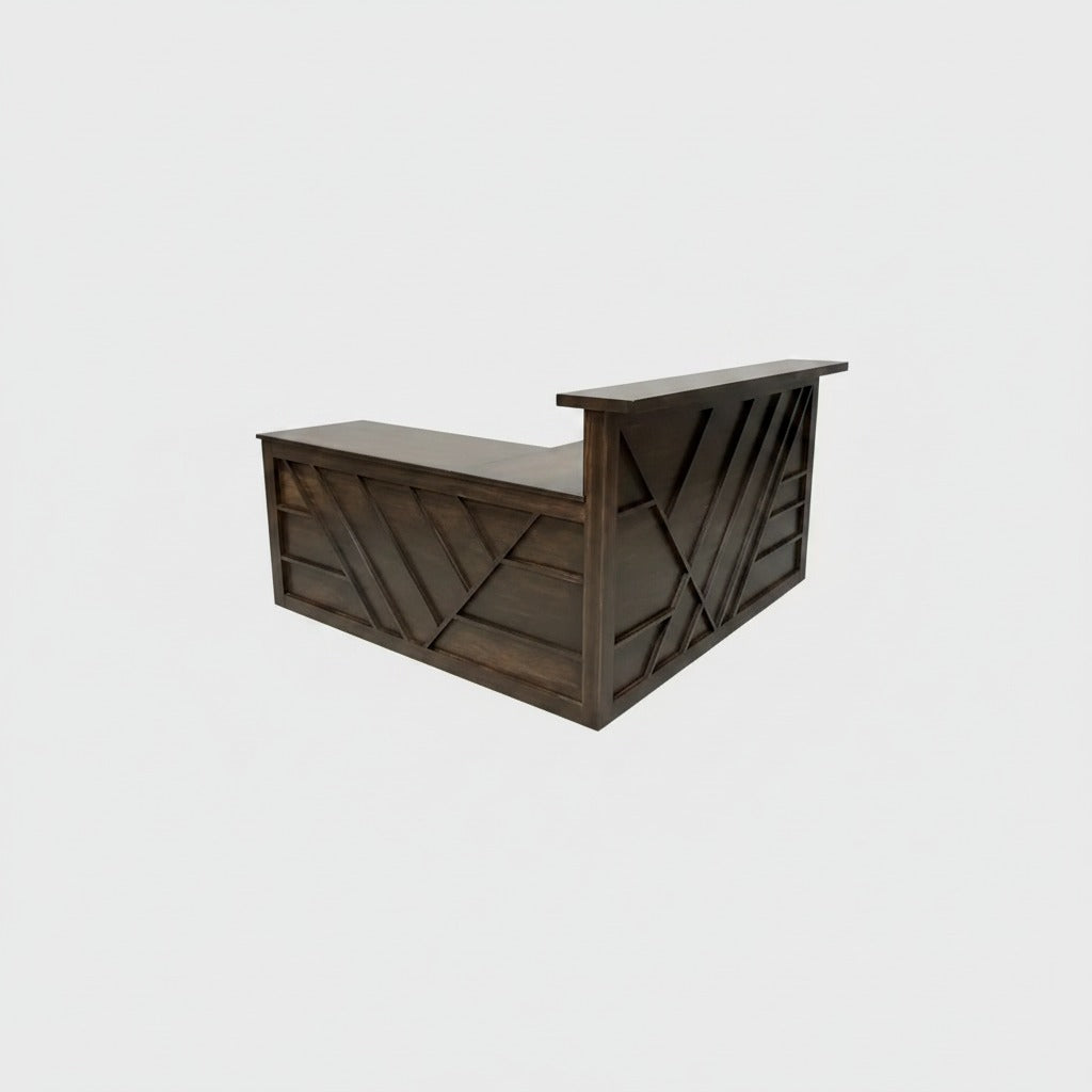 Dark wood reception desk with wraparound geometric paneling and raised transaction counter. Handmade by Red Cloak Home
