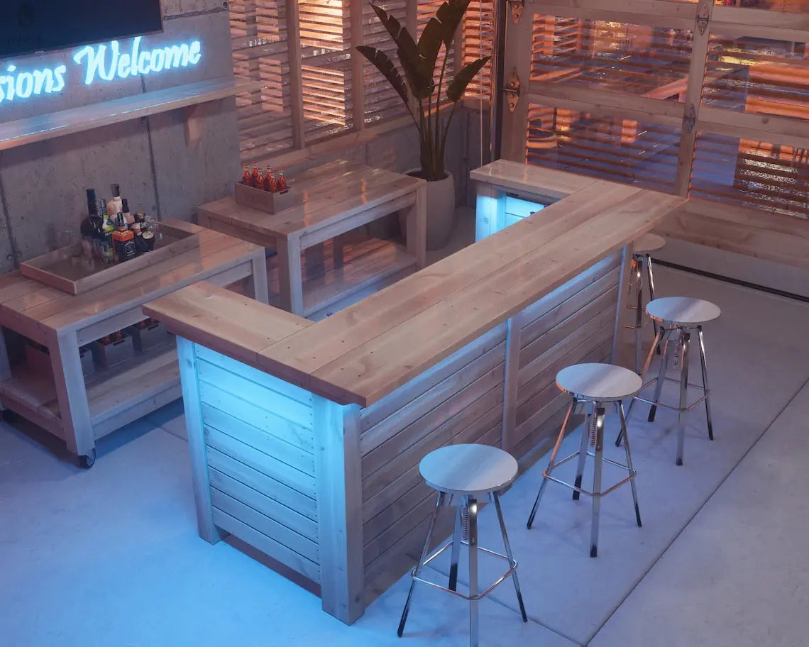 Top view of indoor wood bar with stools, custom-built by Red Cloak Wood Designs for home entertaining spaces