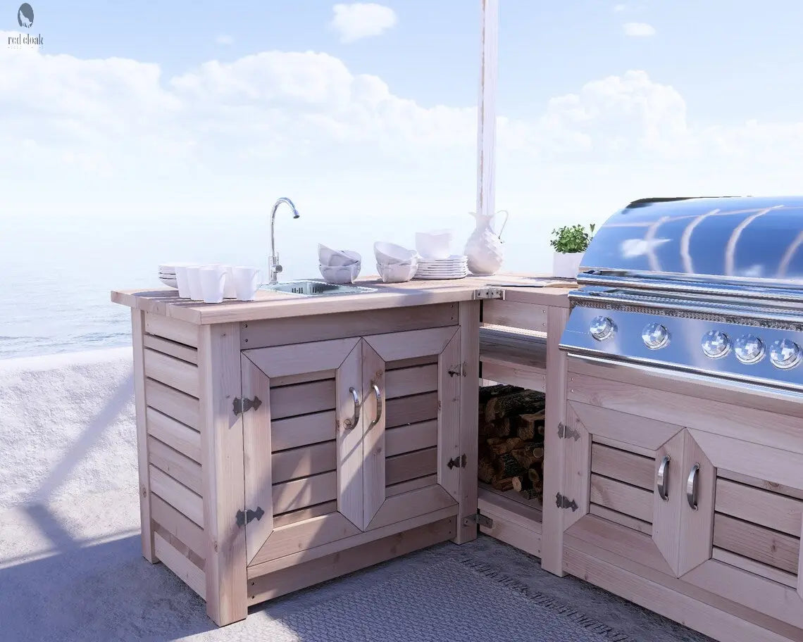 Built-in sink and grill station as part of Red Cloak’s custom outdoor kitchen and bar setup