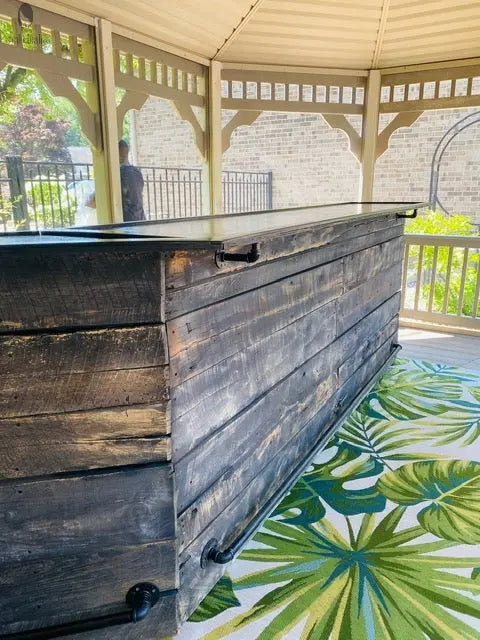 Side view of reclaimed barn wood bar built for patios and porches, sealed for outdoor use year-round with foot rail 