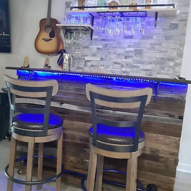 Reclaimed wood bar with LED lighting and bar stools, perfect for indoor home bar setups by Red Cloak Home