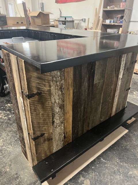 Side panel view of handmade Blackstone bar by Red Cloak Home, featuring reclaimed wood variation, dark metal hardware, and sealed bar top.