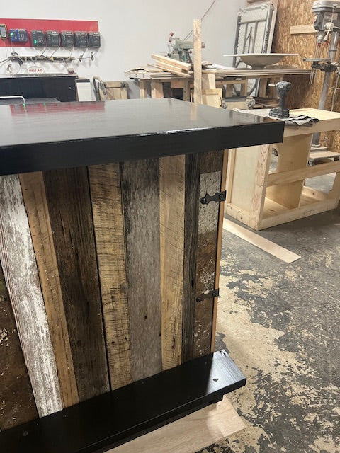 Close front view of handmade wood Blackstone bar by Red Cloak Home, showing reclaimed wood planks, metal hardware, and sealed bar top.