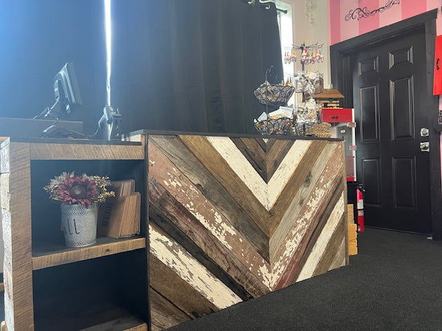Rustic chevron barn wood checkout counter in retail space with POS and display setup – Red Cloak Home